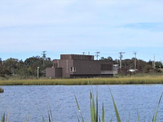 Rendering of the Bay Head Marin substation. The substation is brick and is shown across a body of water.