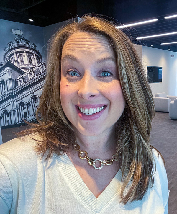 A selfie of Cathy in the lobby of her office.